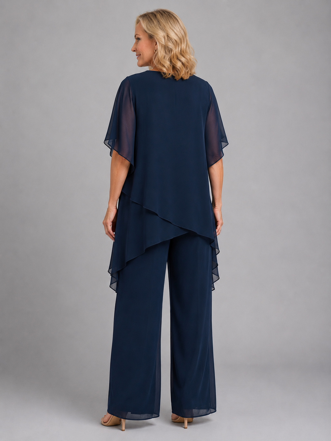 Chic pink chiffon two-piece women's outfit with comfortable wide-leg pants & a flowy top. Relaxed elegance.
