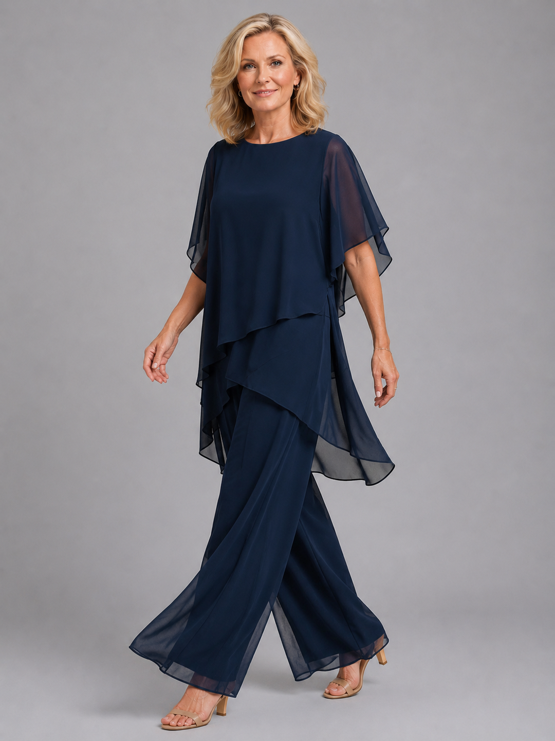 Relaxed fit women's two-piece chiffon outfit. Features a flutter sleeve top and stylish wide leg pants for elegance.