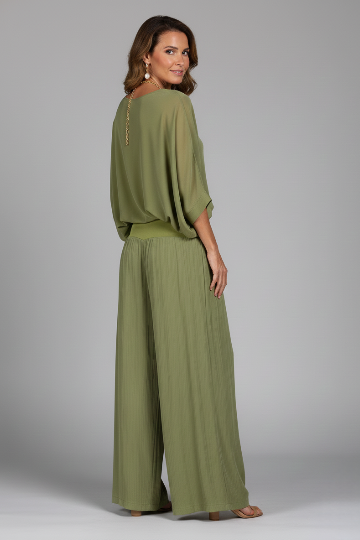 Chic women's two-piece set featuring a flowing chiffon top and wide-leg trousers.