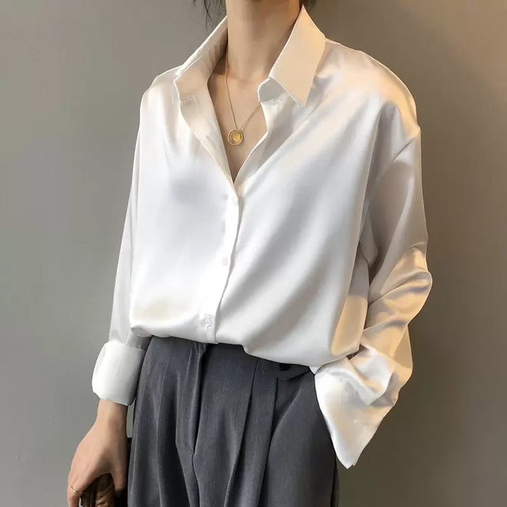 Classic elegant women's blouse, perfect fall fashion piece, versatile for work or events.