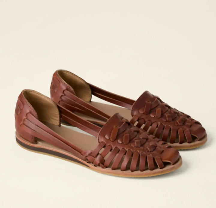 Women's casual flat sandals featuring a closed-toe design, woven texture & slip-on style for effortless summer wear.