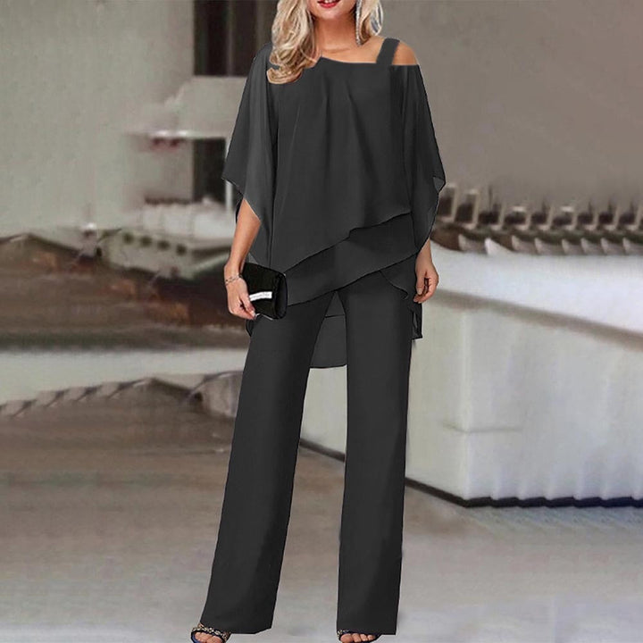 Elegant women's cold shoulder jumpsuit, perfect for evening wear or special occasions, featuring a flattering, flowy design.
