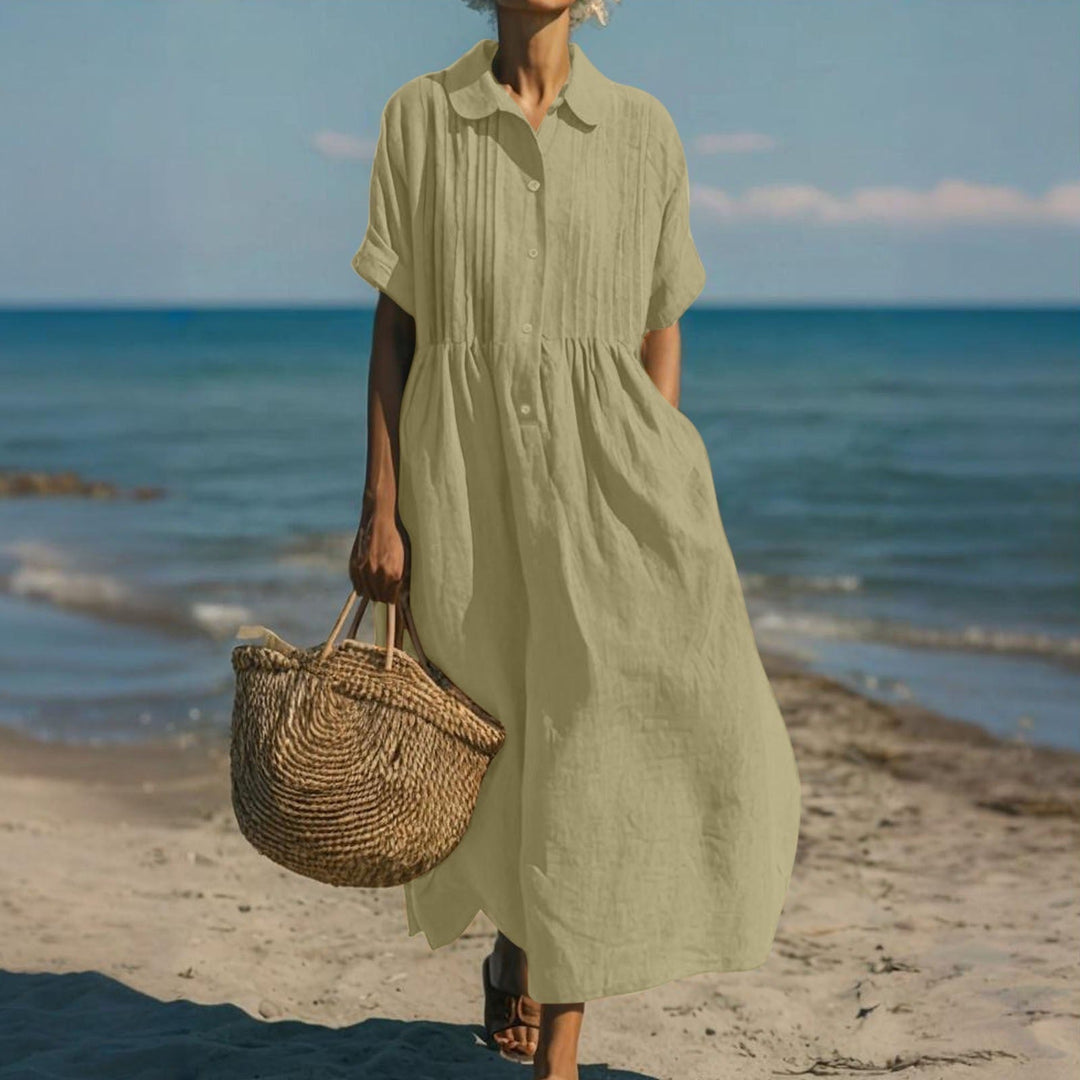 Women's collared buttoned pleated maxi dress. Combining loose fit, elegance, and comfort.