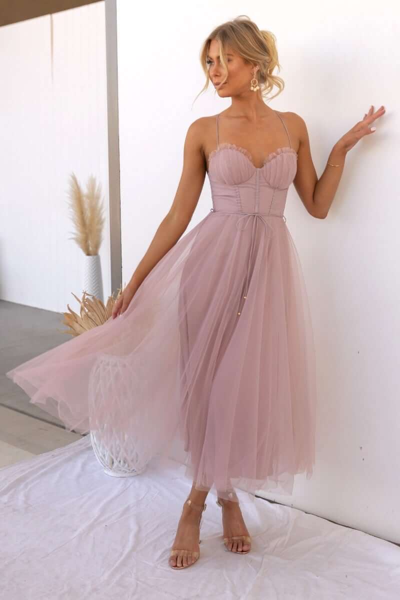Elegant women's corset midi dress with delicate spaghetti straps and flowing tulle skirt.