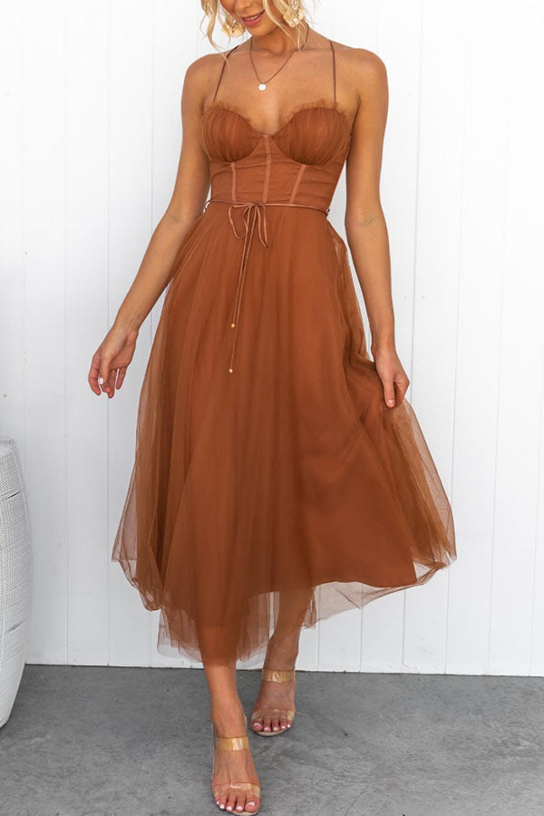 Elegant women's formal dress with a sweetheart neckline corset and a tiered tulle skirt.