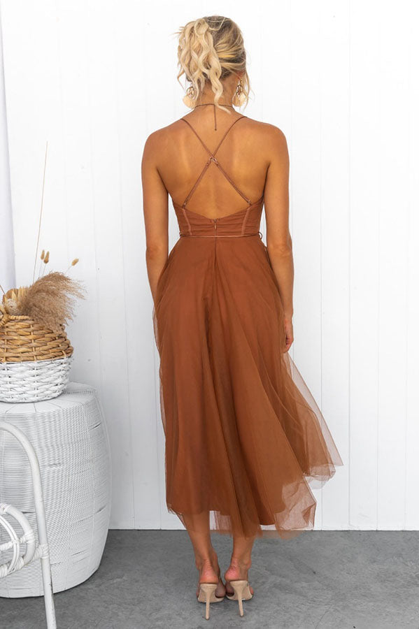 Flattering women's fashion dress with a cinched corset waist and a flowing tulle hem.