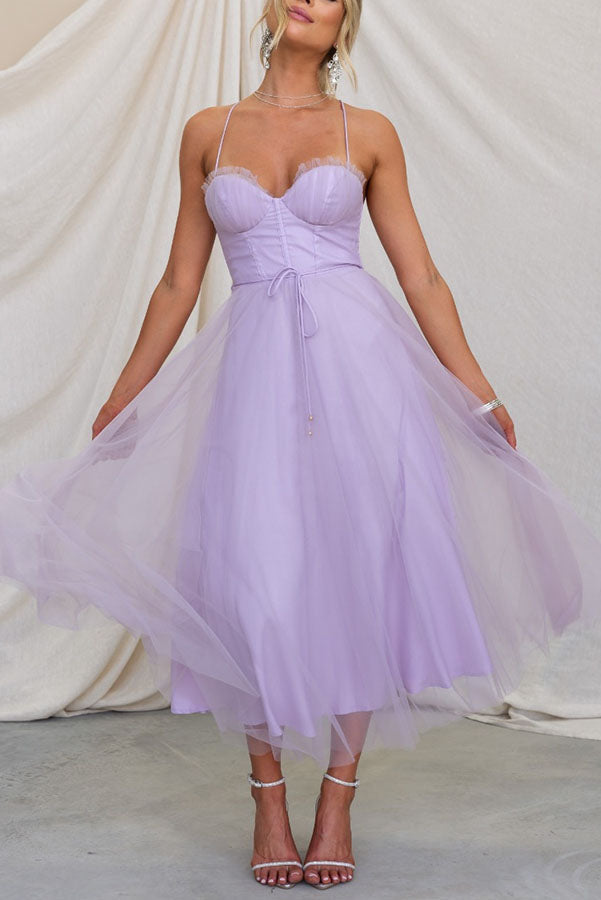Perfectly tailored midi dress with a corset top and elegant spaghetti straps for any event.