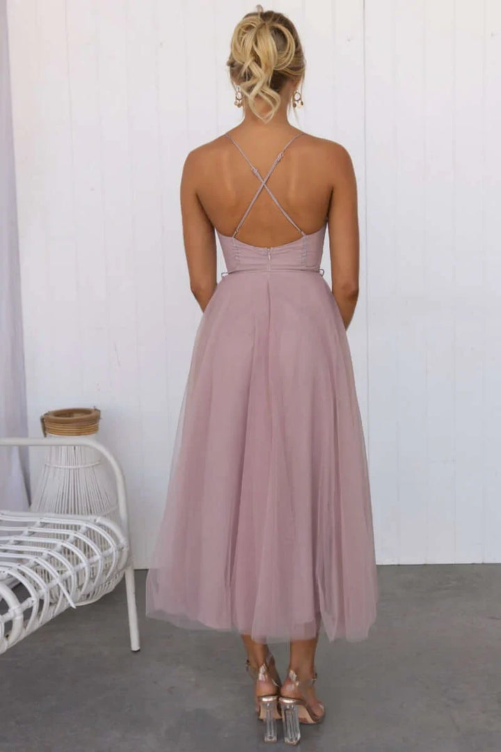 Stylish midi dress for weddings, designed with a corset top and airy spaghetti straps.