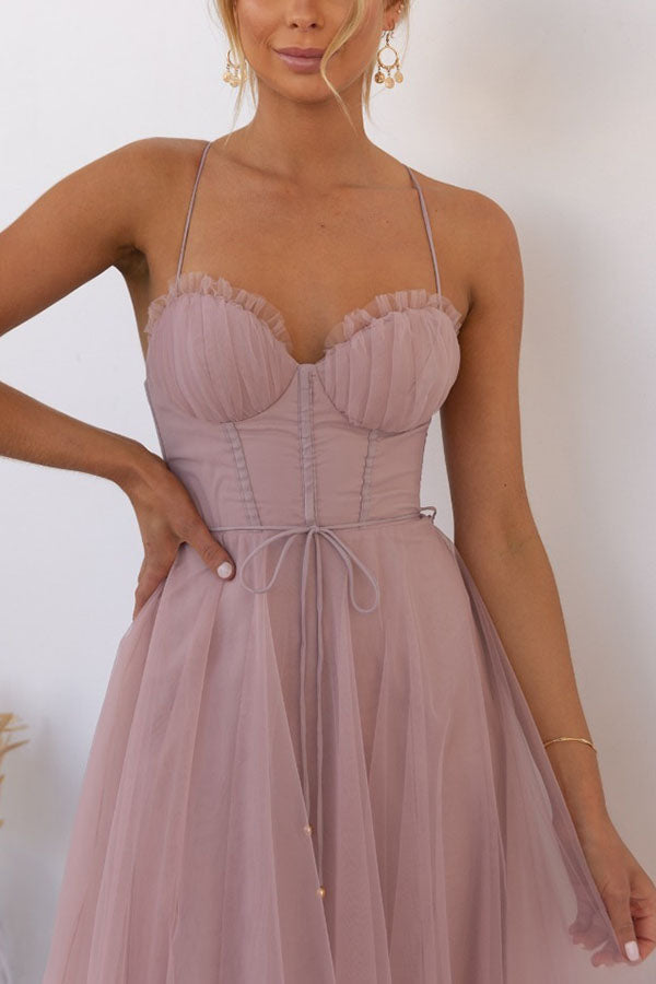 Summer-ready women's dress: midi length, corset detail, and playful tulle skirt.