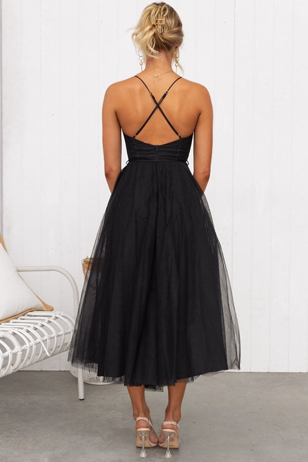 Sophisticated women's party dress showcasing a fitted corset and layered tulle skirt.
