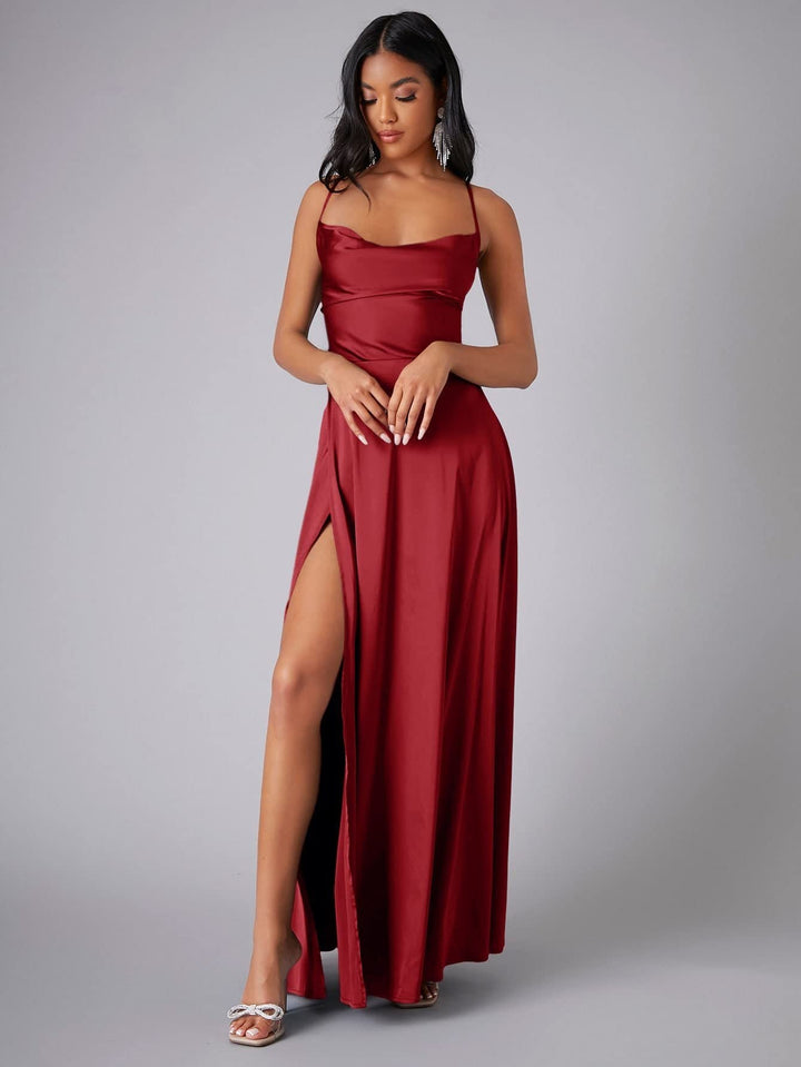 Luxurious long formal dress for women, featuring a cowl neck, backless design, and elegant slit for evenings.