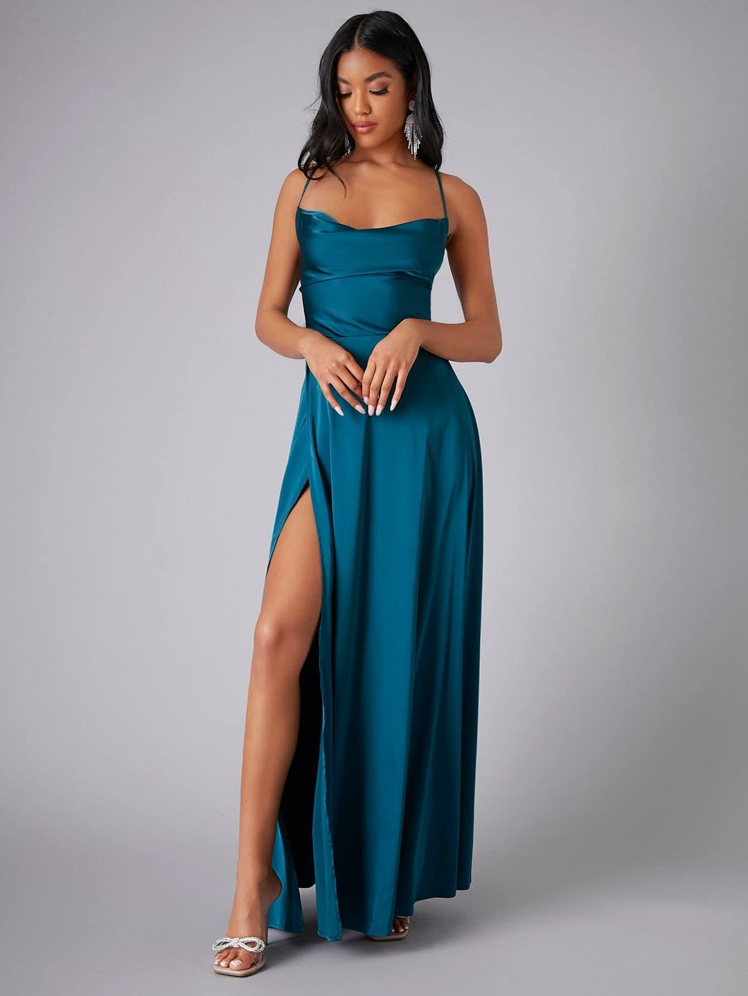 Glamorous women's formal evening dress: cowl neck, backless silhouette, and alluring high slit for special occasions.