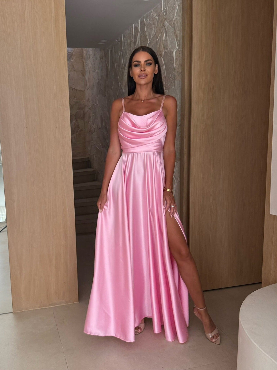 Modern women's cowl neck maxi dress, featuring delicate pleats and a long silhouette, for formal occasions.