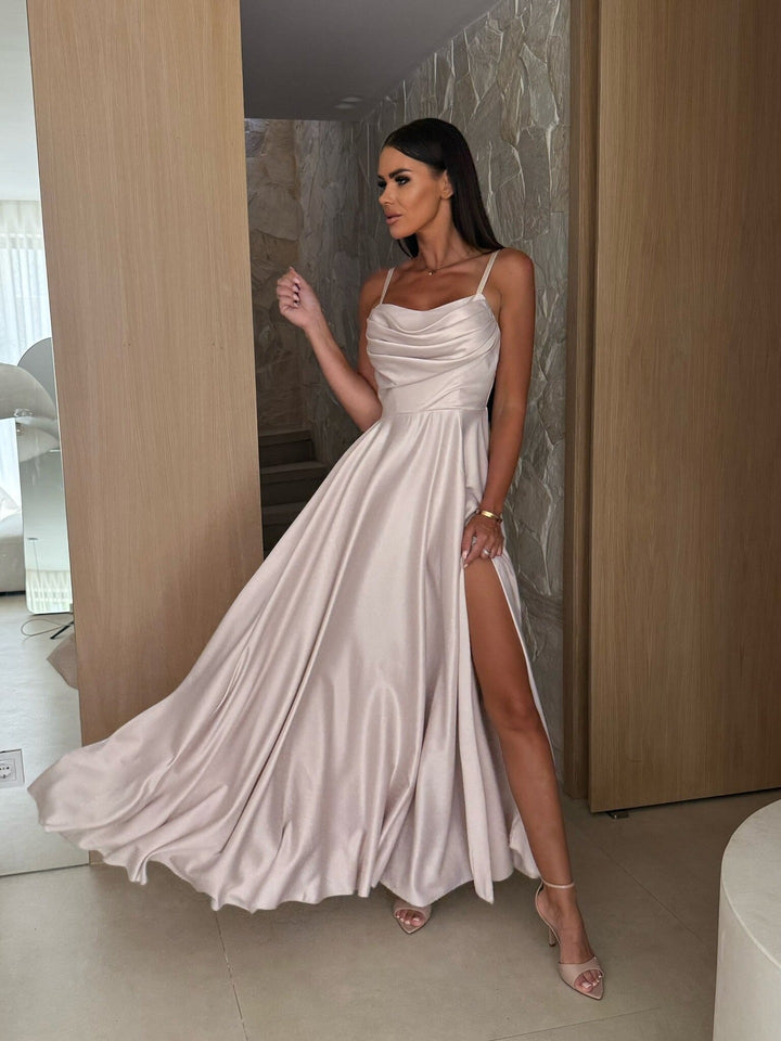 Chic women's formal dress: A long pleated maxi dress with a graceful cowl neck, suitable for special events.