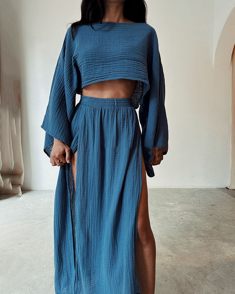 Fashionable women's crop top & side split maxi skirt set. Perfect chic apparel for a stylish elegant outfit.