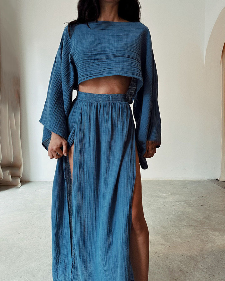 Fashionable women's crop top & side split maxi skirt set. Perfect chic apparel for a stylish elegant outfit.