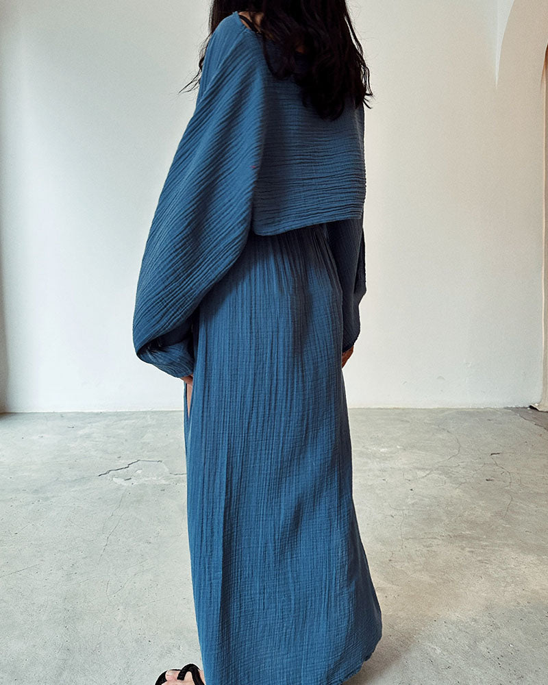 Sophisticated women's elegant two-piece set: long sleeve crop top & maxi skirt with a flattering side split.