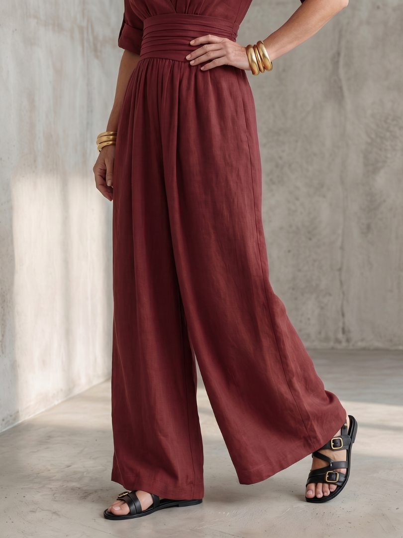 Modern women's fashion jumpsuit, wide leg, elegant cross front, perfect for stylish looks.