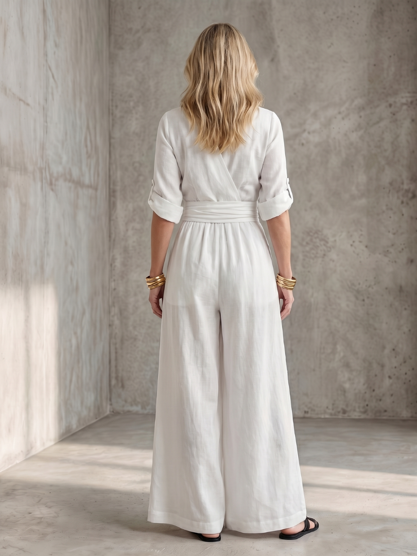 Versatile women's elegant jumpsuit with cross front and wide leg, suitable for summer fashion.