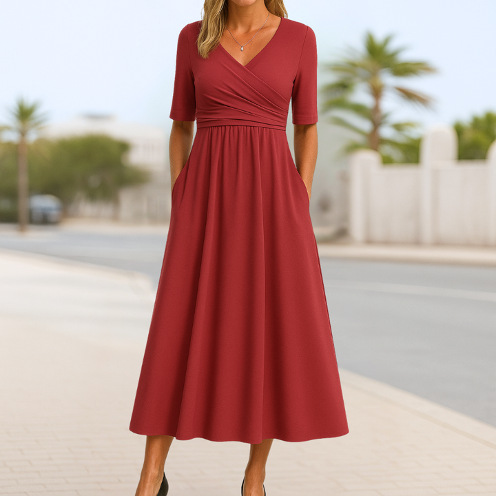 Feminine short sleeve midi dress with a stylish crossed V-neck, ideal for elegant casual or everyday wear.