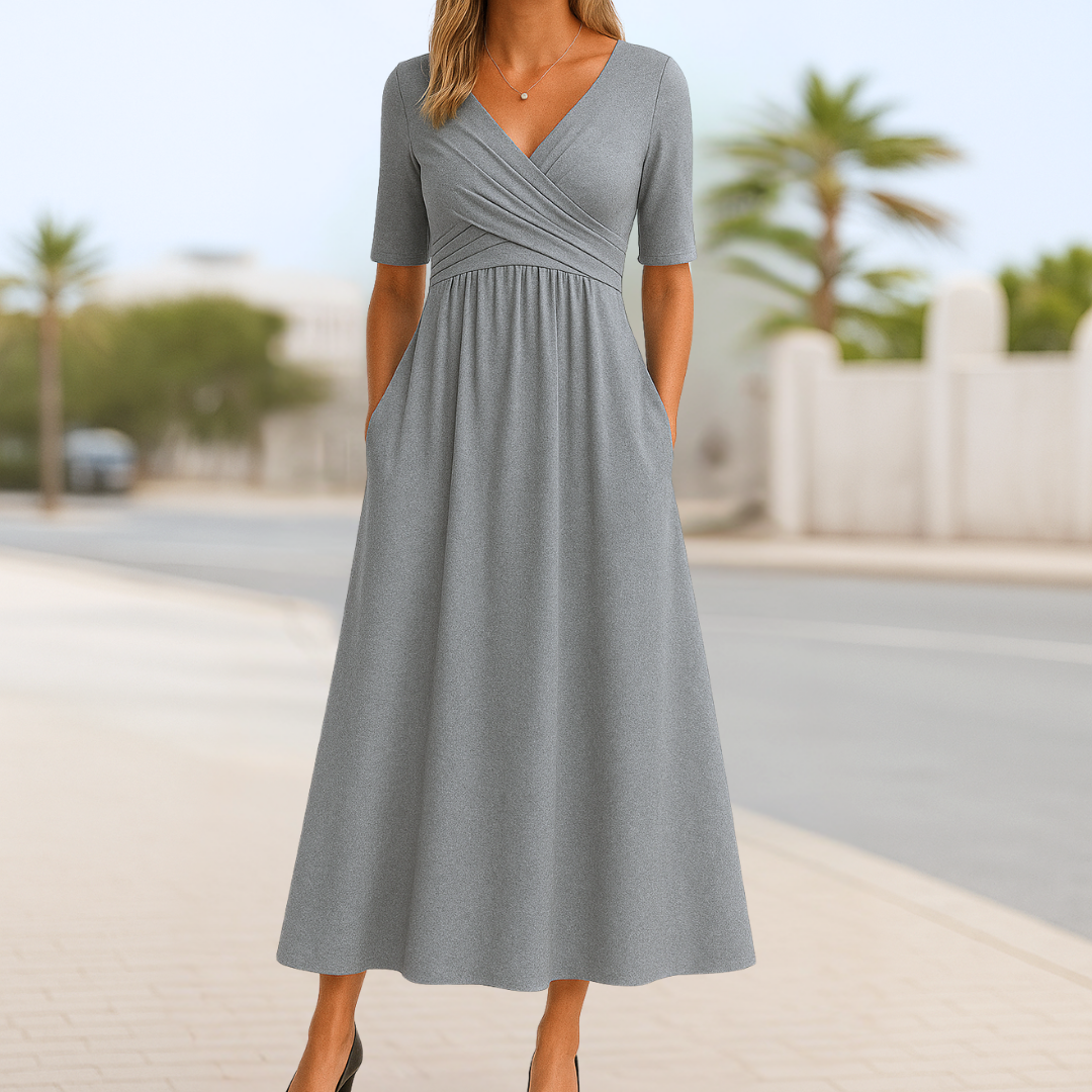 Flowy women's flared midi dress with elegant short sleeves and a crossed V-neck, comfortable for all-day wear.