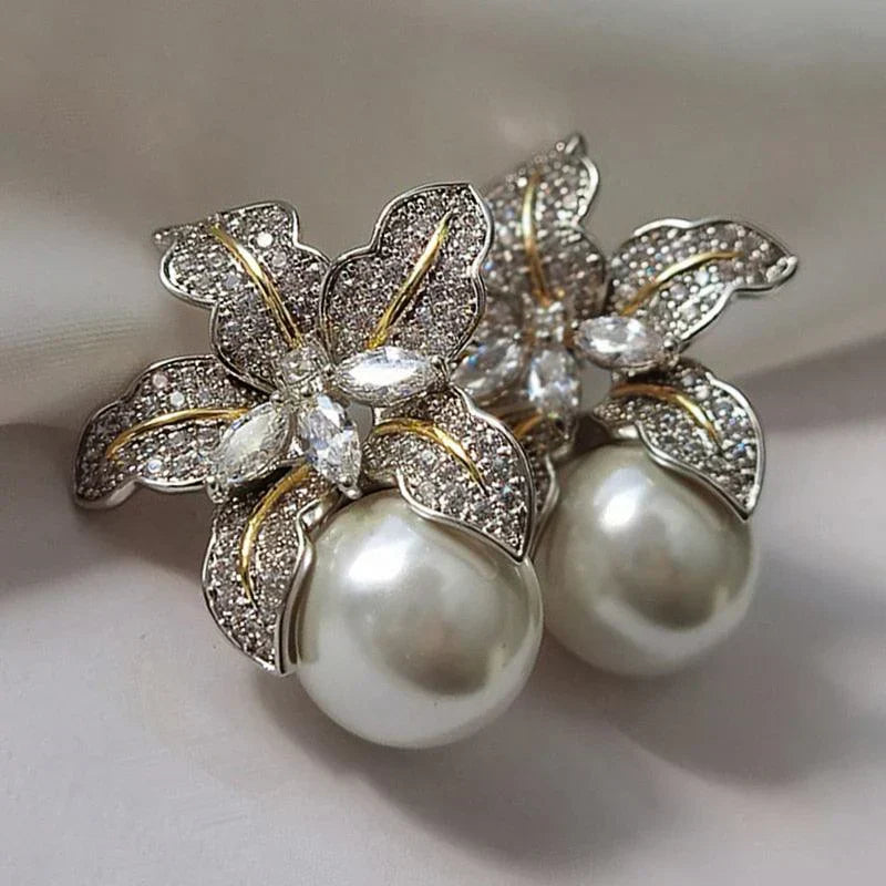 Elegant women's dangle earrings with delicate floral design & shimmering pearls. Classic style jewelry, perfect gift.
