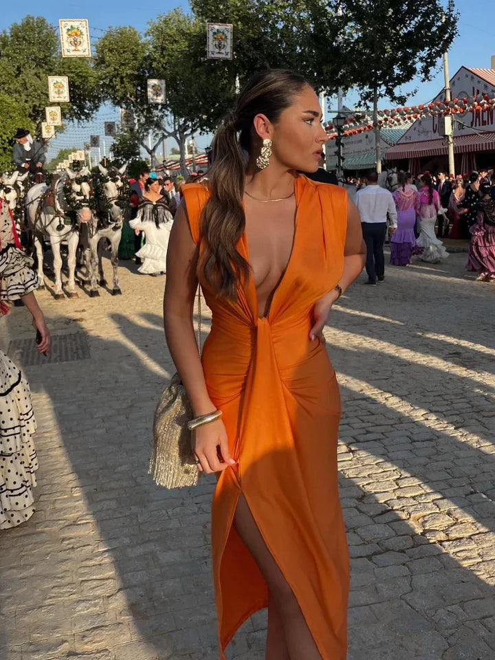 Sophisticated sleeveless ruched maxi dress for women, featuring a deep V-neck, ideal for special occasions.