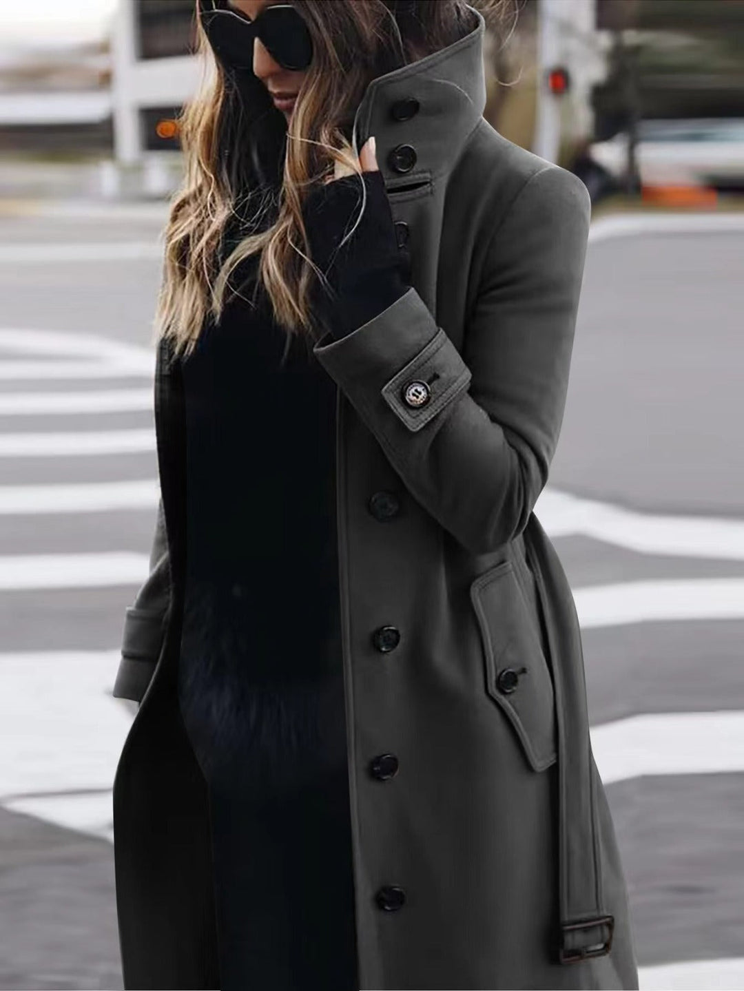 Urban style ladies coat, showcasing a chic double-breasted silhouette and a modern stand-up collar.