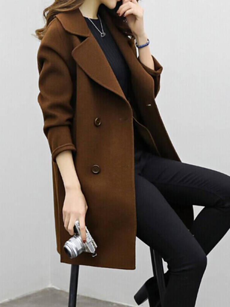 Fashionable women's double-breasted longline coat. Elegant outerwear for chic autumn & winter days.