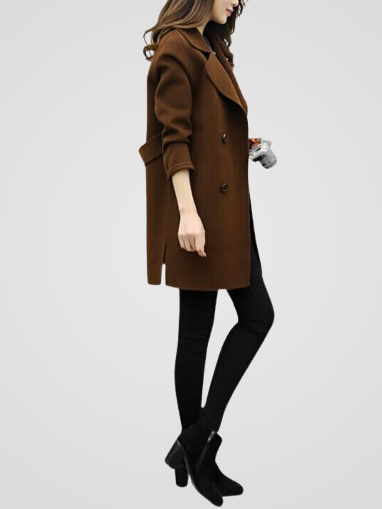 Close-up of elegant double-breasted buttons on a women's longline coat. Premium autumn/winter fashion.