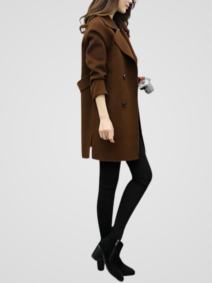 Close-up of elegant double-breasted buttons on a women's longline coat. Premium autumn/winter fashion.