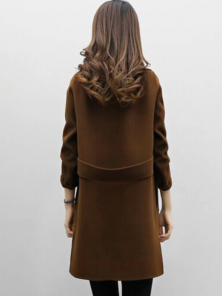 Women's classic longline coat, double-breasted, styled for a modern & chic autumn/winter outfit.