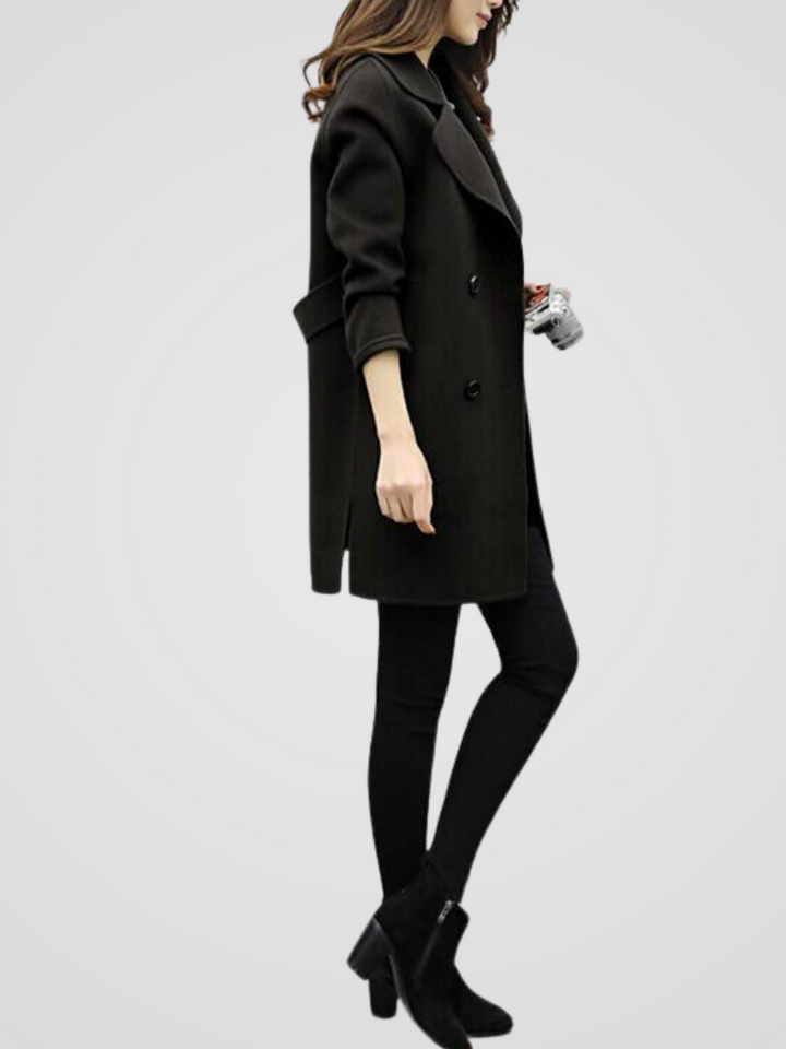 Stylish women's longline coat, double-breasted, showcasing elegant design for classic winter fashion.