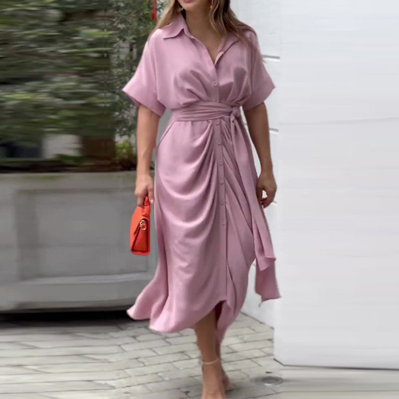 Comfortable flowy women's drape midi summer dress. Elegant short sleeve design for versatile casual or vacation style.
