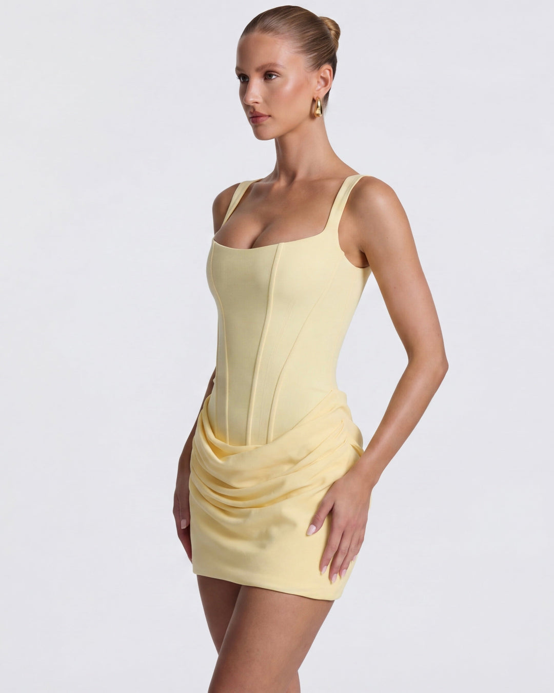 Sleeveless elegant mini dress, sculpted fit, women's draped corset style.