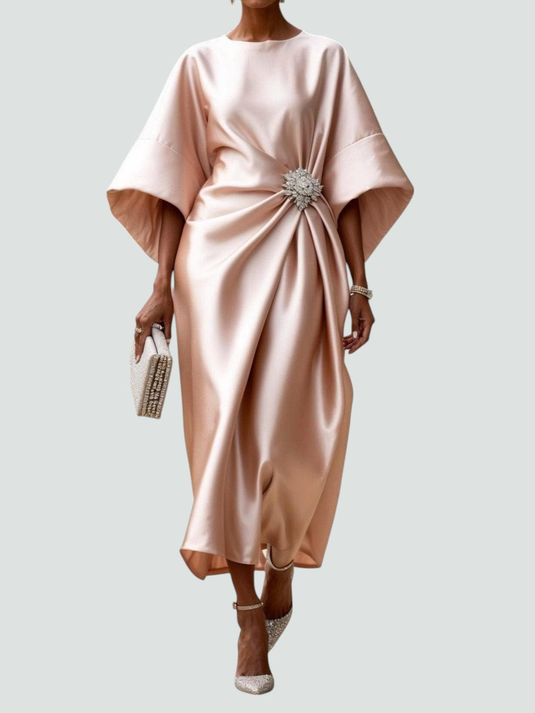 Party-ready women's elegant draped maxi dress, featuring a chic brooch, ideal for sophisticated events.