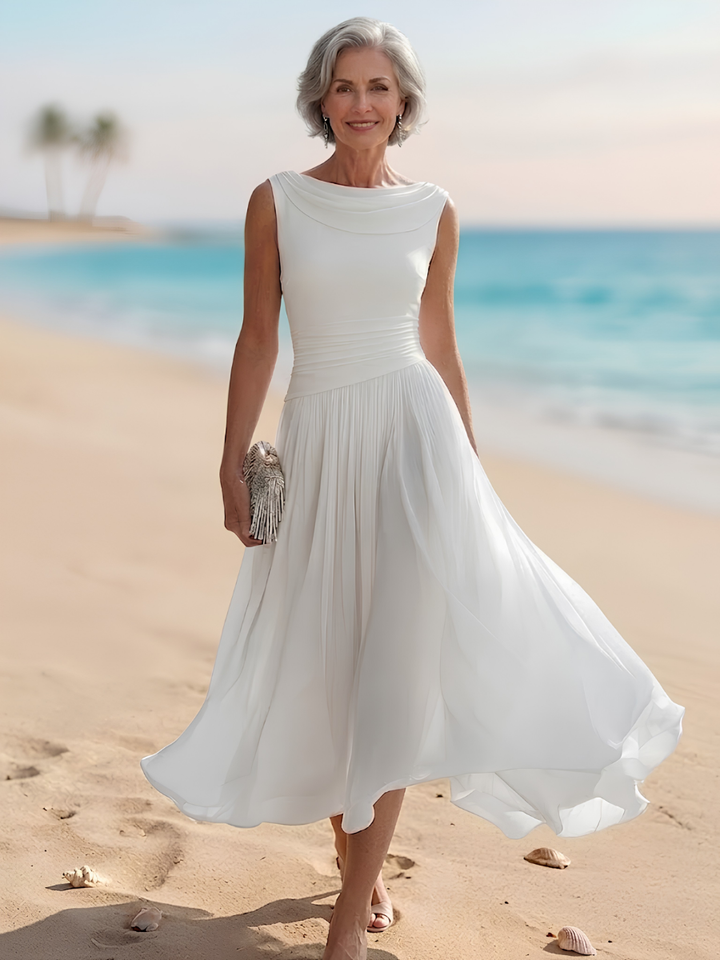 Elegant women's draped neck pleated A-line midi dress, perfect for a wedding guest or formal occasion.