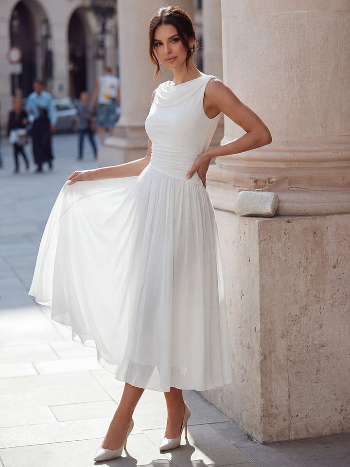 Sleeveless draped neck pleated midi dress for women, ideal for wedding guests or formal events.