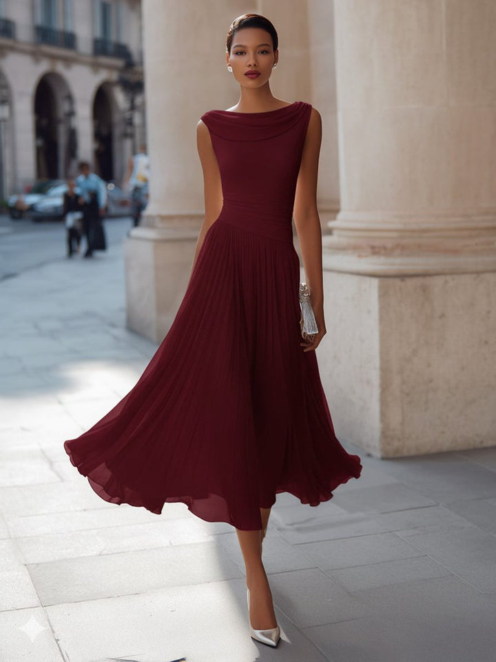 Sophisticated women's pleated midi dress, elegant draped neck design for wedding guests.