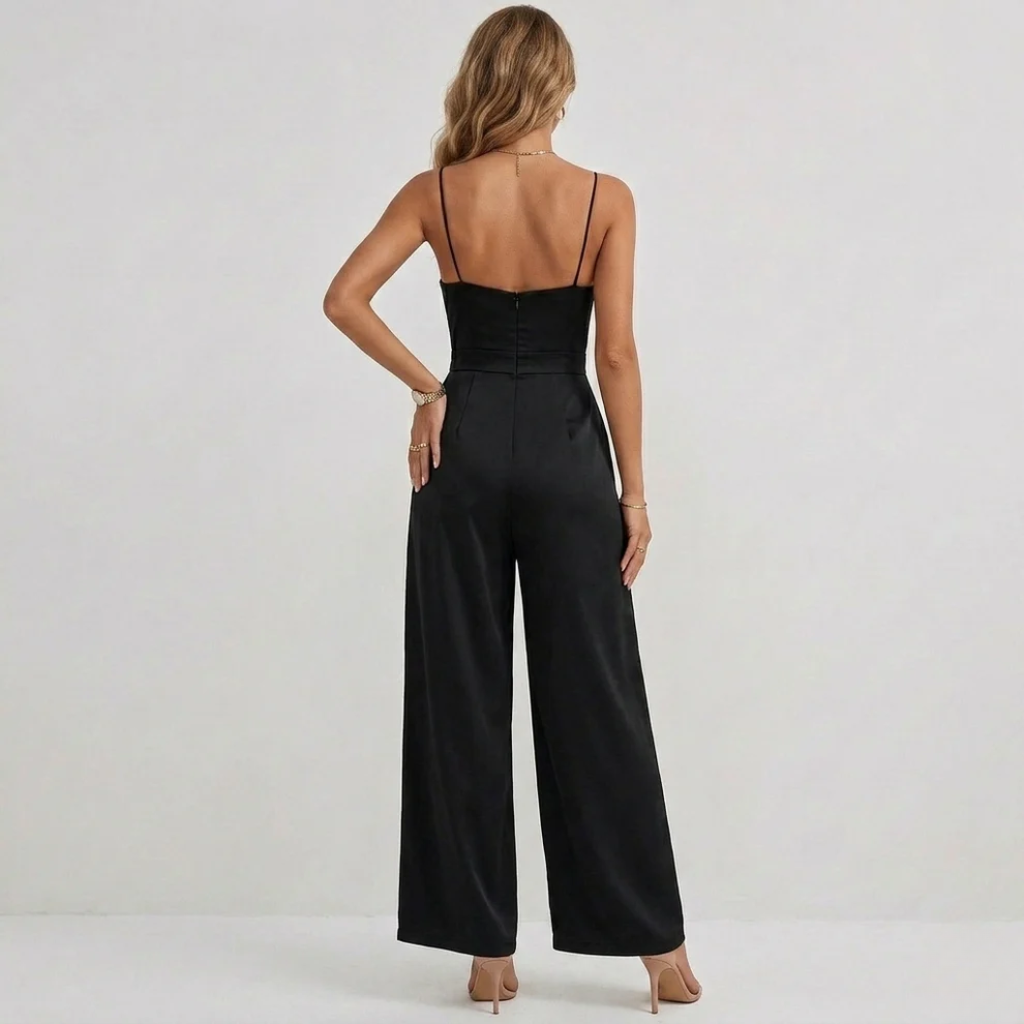 Chic women's jumpsuit featuring intricate draping and stylish pleats on a high-waisted wide-leg silhouette.