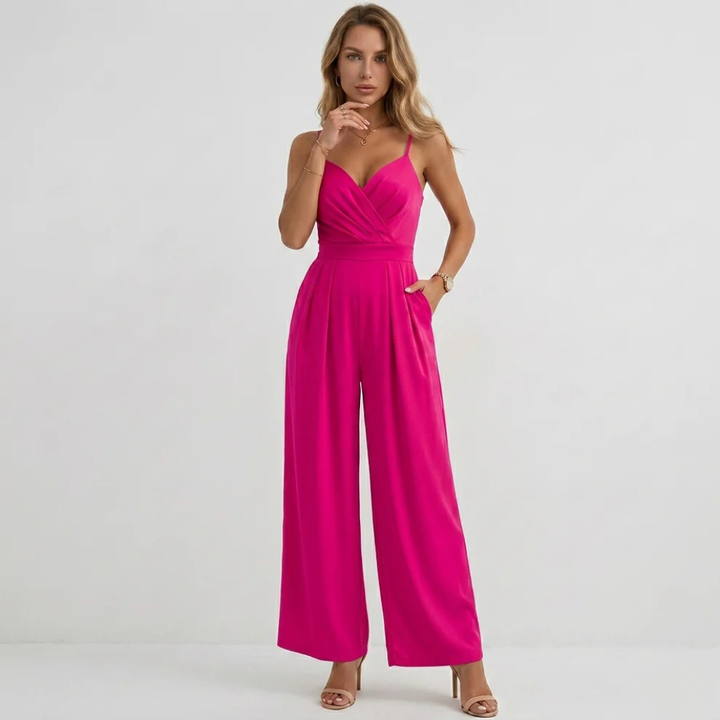 Modern chic women's jumpsuit: draped bodice, high-waisted pleated wide-leg trousers, perfect for stylish events.