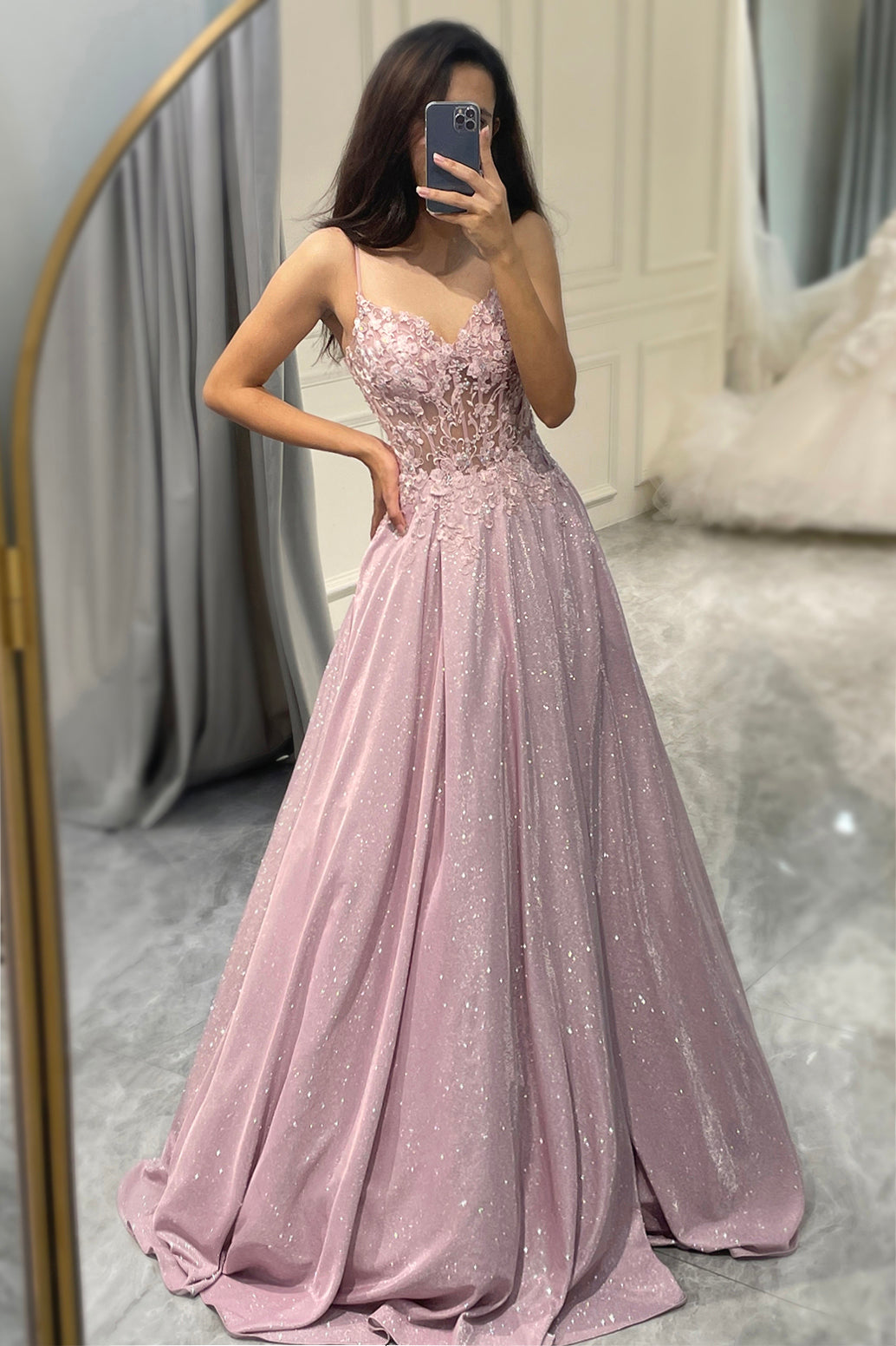Formal women's evening gown for wedding guests, elegant embellished maxi dress for special occasions.