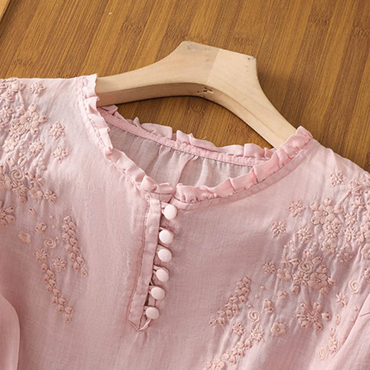 Beautifully embroidered women's 3/4 sleeve blouse with button-front, suitable for spring elegance.