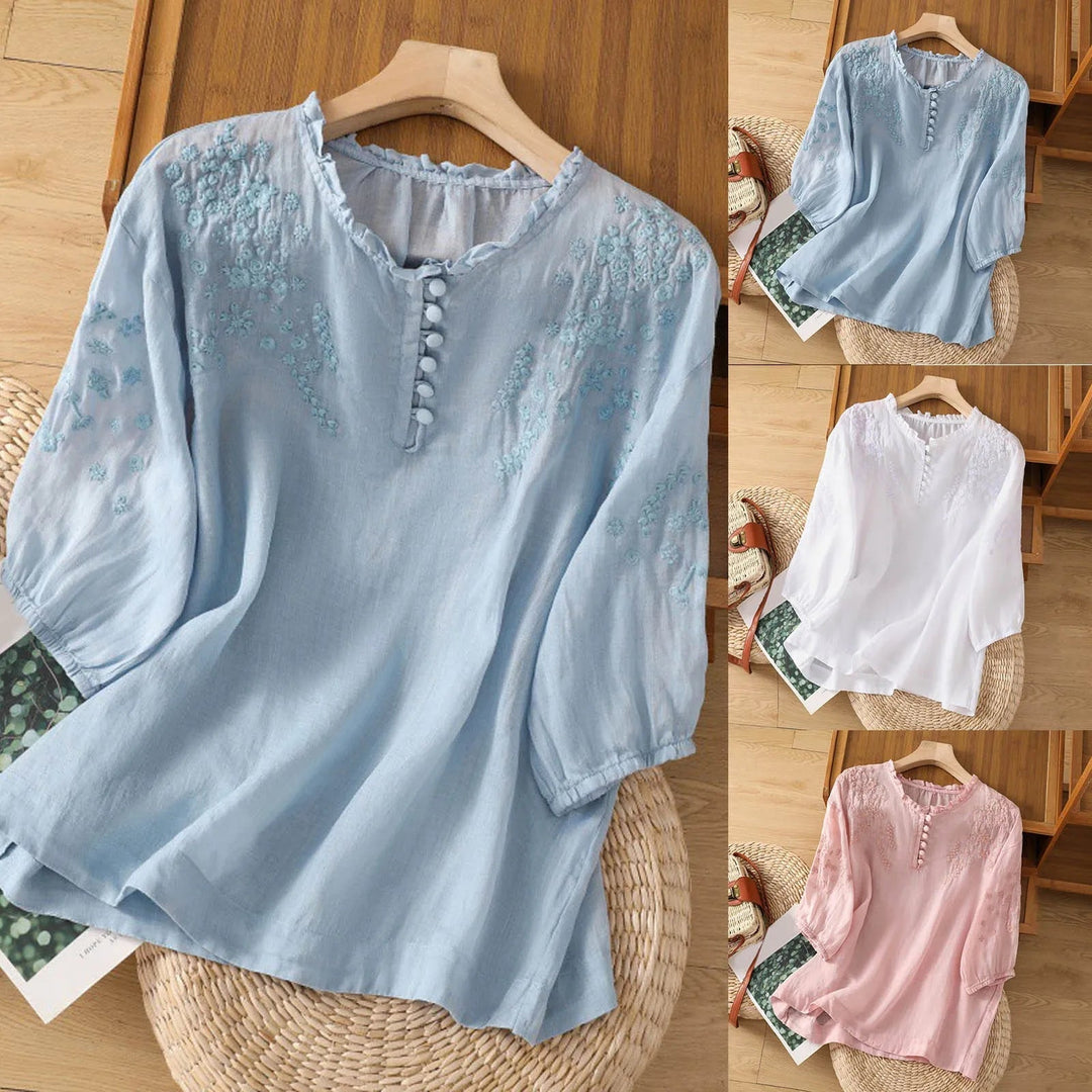 Comfortable & elegant women's 3/4 sleeve blouse with intricate embroidery, a casual chic spring top.