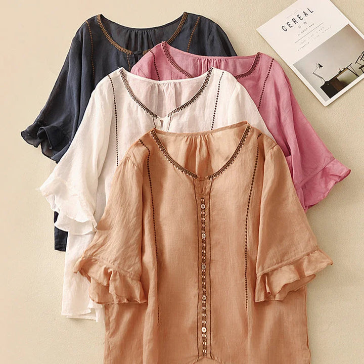 Casual chic embroidered V-neck blouse for women, featuring intricate embroidery and stylish ruffled 3/4 sleeves.
