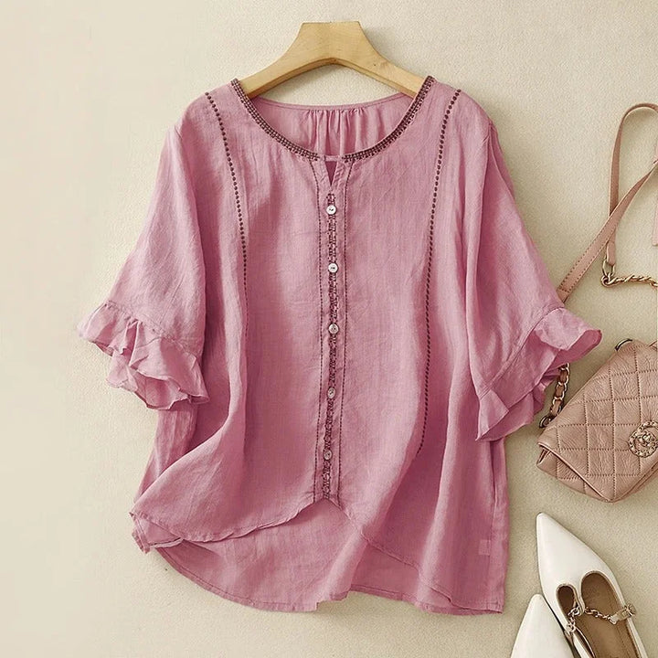Chic women's embroidered V-neck blouse with flowy 3/4 ruffled sleeves and subtle button front, perfect for summer.