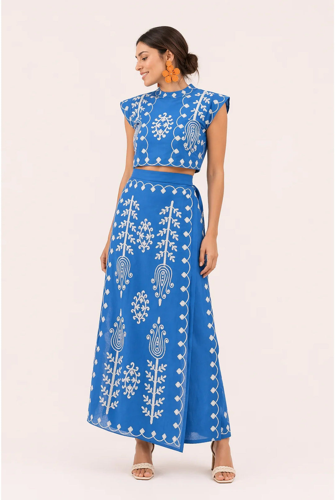 Fashionable women's two-piece fringe set with elegant embroidery. Chic summer outfit for occasion wear.