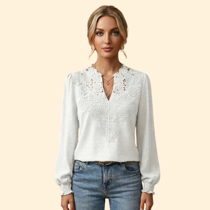 Classy women's lace blouse with fine embroidery, offering a chic and versatile option for ladies.