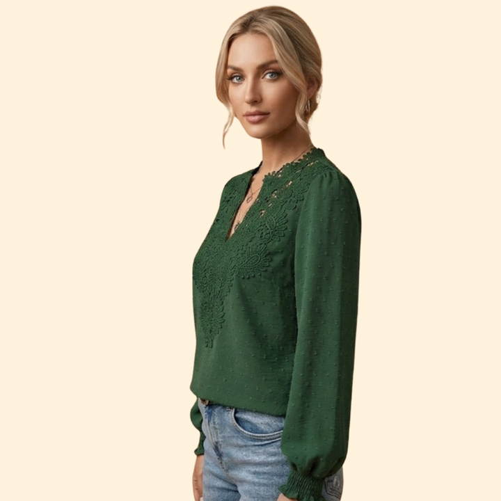 Stylish ladies' embroidered blouse with delicate lace details, an elegant top for any occasion.