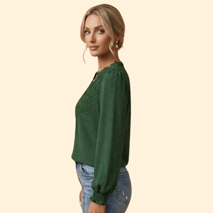 Fashionable women's elegant blouse with detailed lace and embroidery, great for summer style.